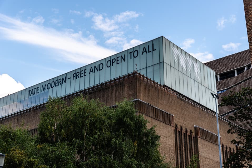 Tate Modern building exterior with 'Free and open to all' signage