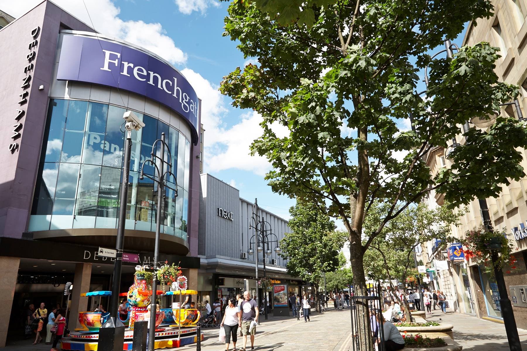 The Frenchgate Centre shopping centre in Doncaster, with its curved glass entrance and Frenchgate sign